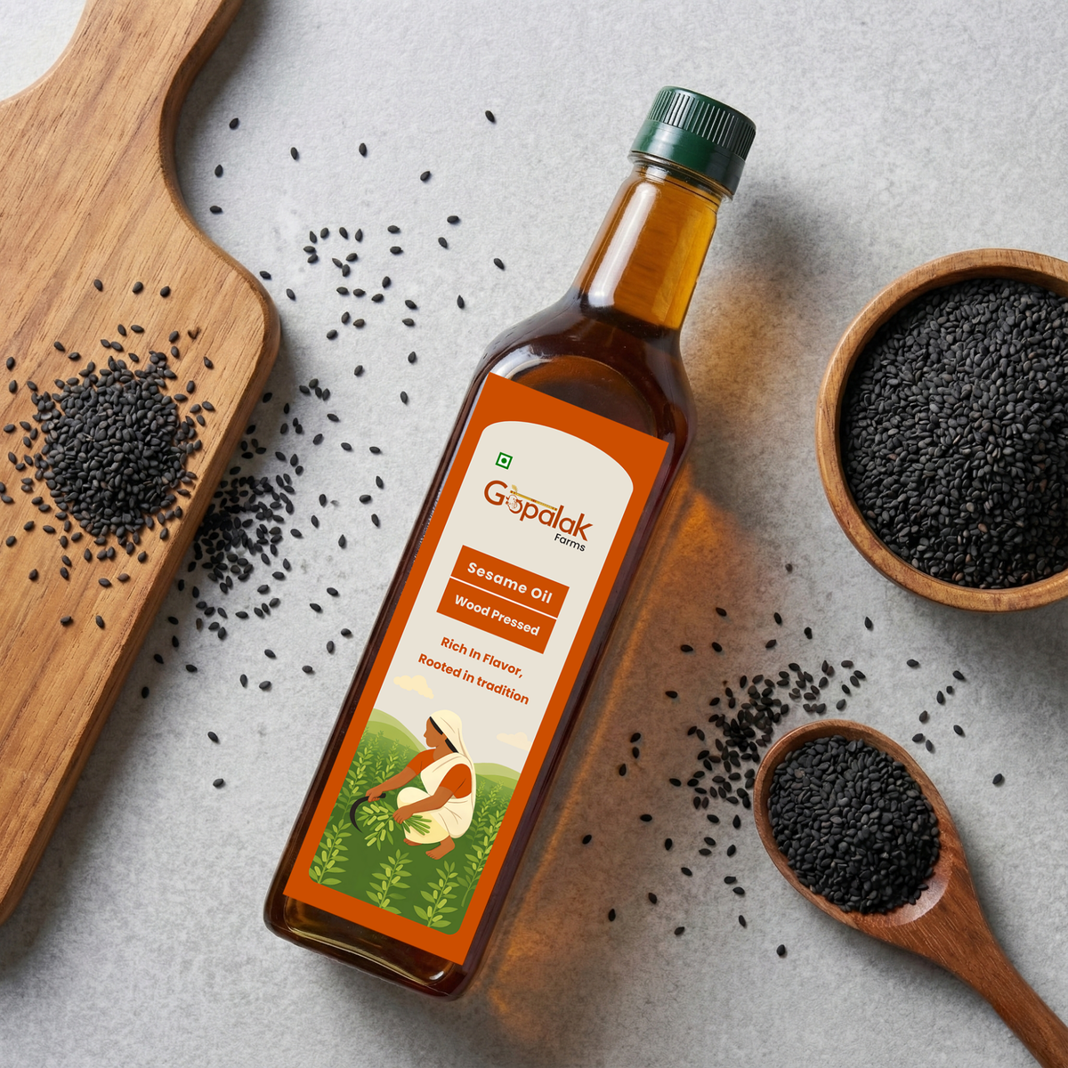 Gopalak Farms wood pressed black sesame oil bottle with black sesame seeds
